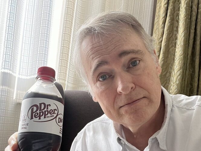 Lonnie Webb holding a Diet Dr. Pepper